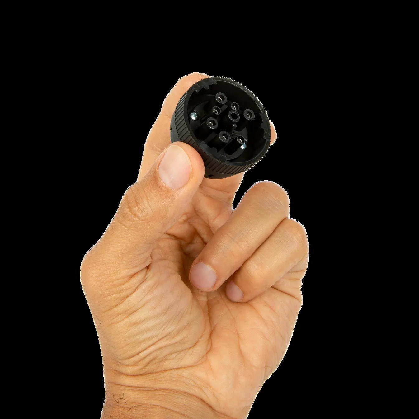 The IOSiX ELD in a hand, showing its built-in 9-pin connector